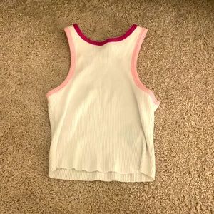 This white top with hot pink and pink lining is perfect for the summer.